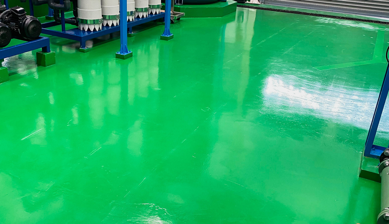 The concrete floor is covered with green epoxy